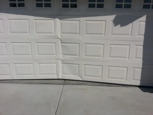 Cracked Garage Door Panel after a Car Reversed on it and. broke it